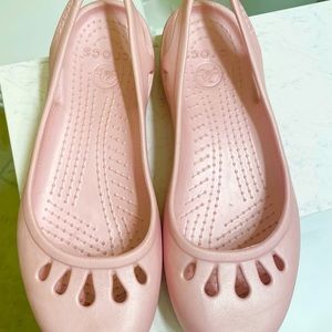 Pink croc flats